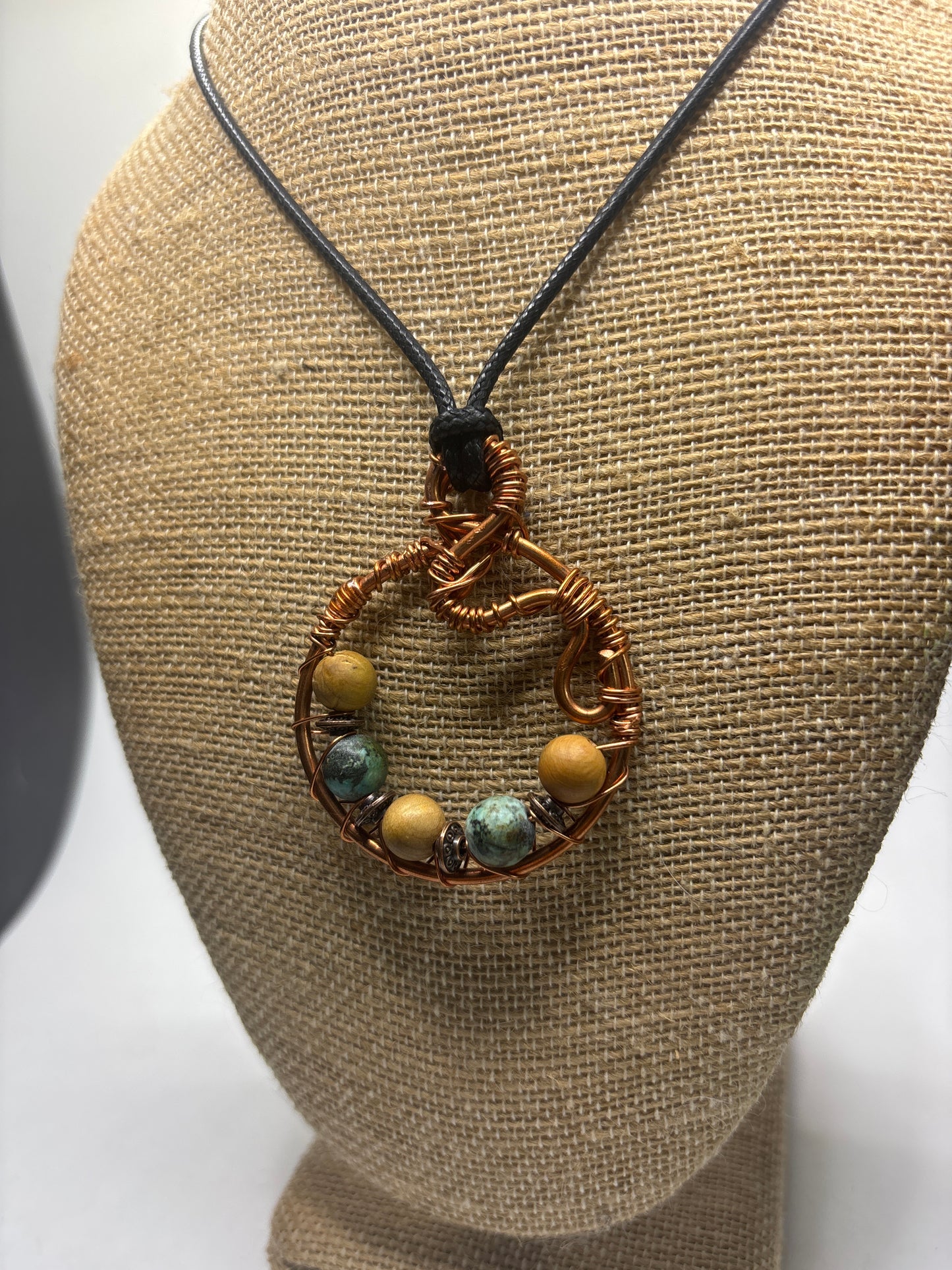 Earth mother circular abstract pendant