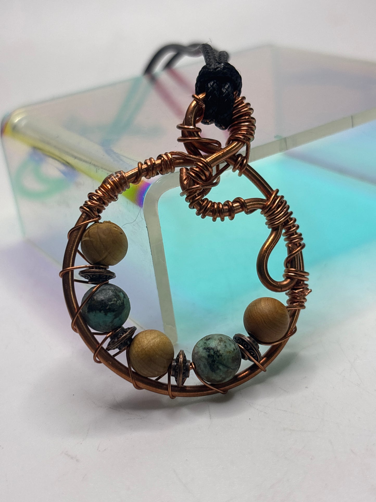Earth mother circular abstract pendant
