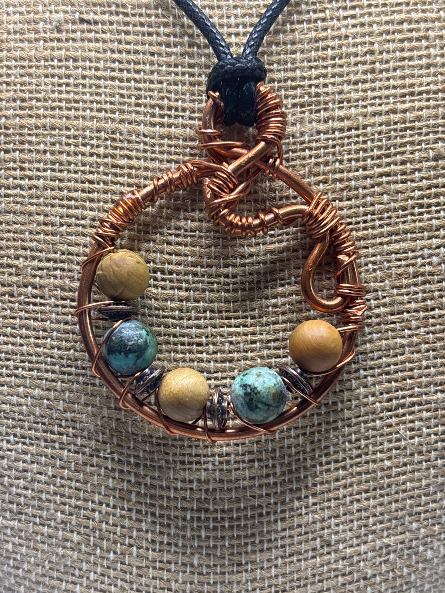 Earth mother circular abstract pendant
