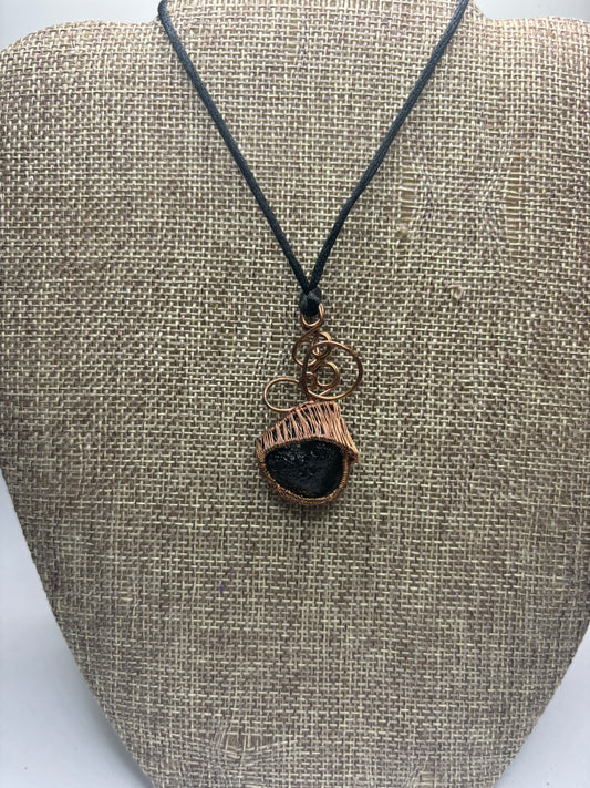 Tourmaline on black cord
